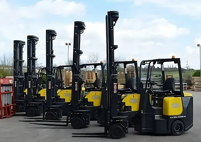 Line-up of Aisle-Master articulated forklifts outdoors