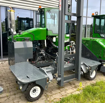 Green Combilift multidirectional forklift with forks lowered