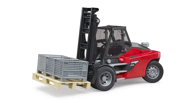 Diesel forklift carrying a pallet of crates