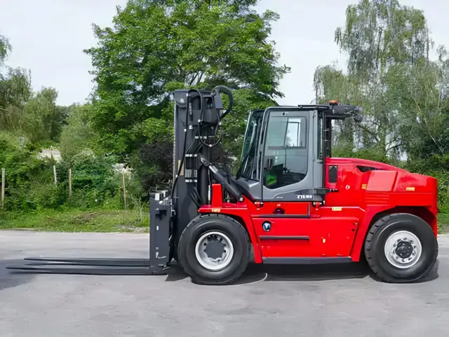Red heavy diesel forklift with a cab, side view