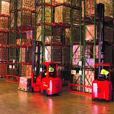 Aisle-Master articulated forklift in a narrow warehouse aisle