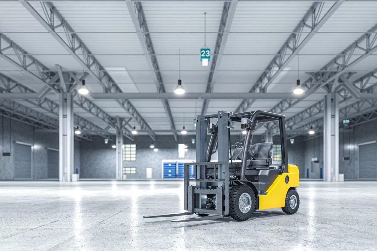 Electric forklift operating inside warehouse