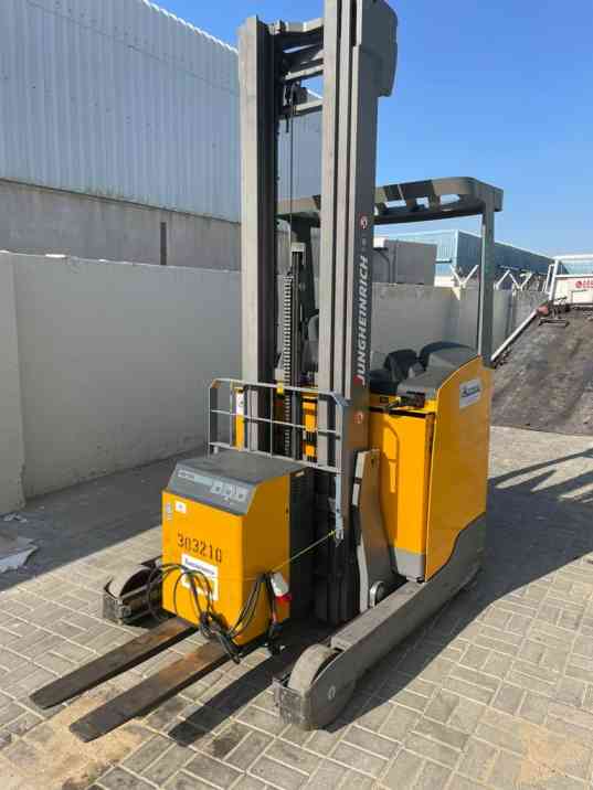 Yellow electric forklift with tall mast