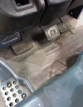Forklift foot pedals and operator footwell