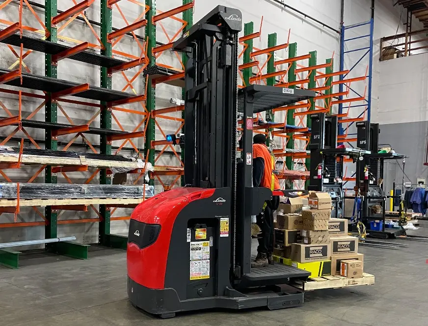 Linde order picker beside cantilever racking loaded with long materials